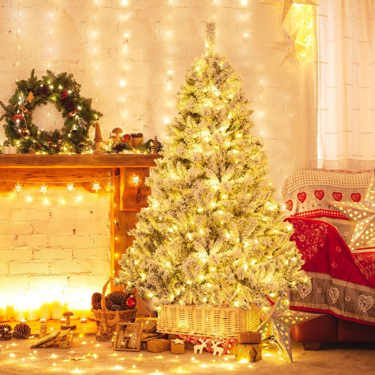 Lifelike 6 ft artificial Christmas tree with warm white LED lights, perfect for festive home decoration.