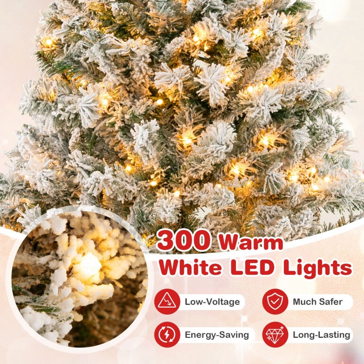 Close-up of a 6 ft artificial Xmas tree with 300 warm white LED lights, featuring snow-like flocking for a festive look.