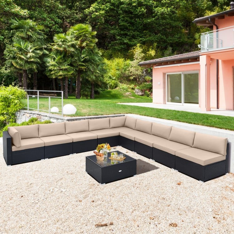 L-shaped outdoor wicker conversation set with beige cushions, featuring a tempered glass tabletop for stylish patio.
