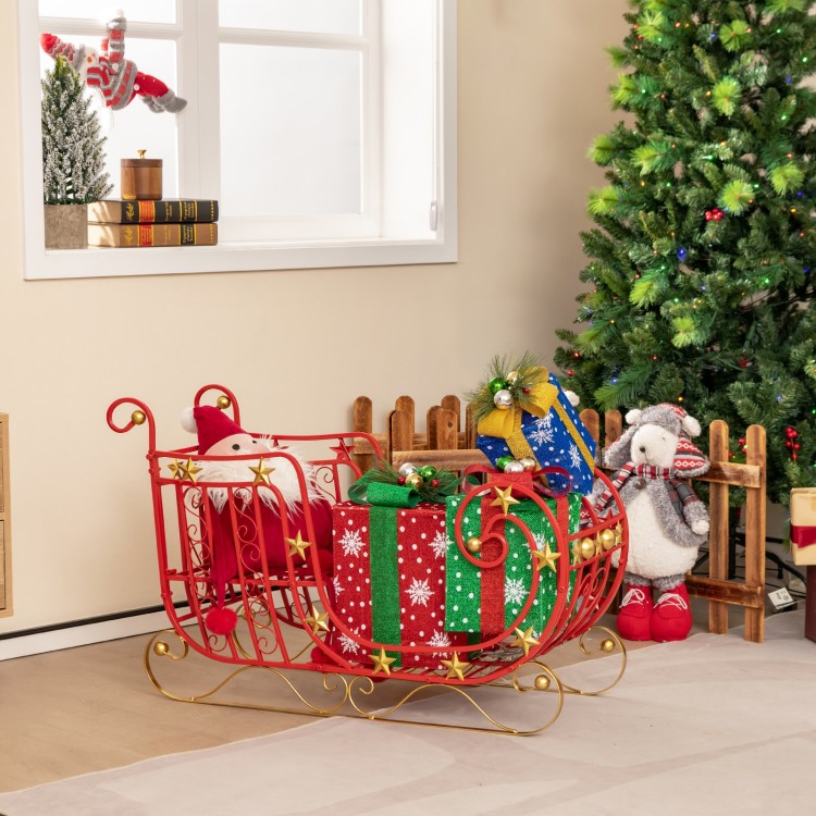 Metal Christmas Santa sleigh with spacious cargo area, featuring curled edges and golden star accents for festive decor.