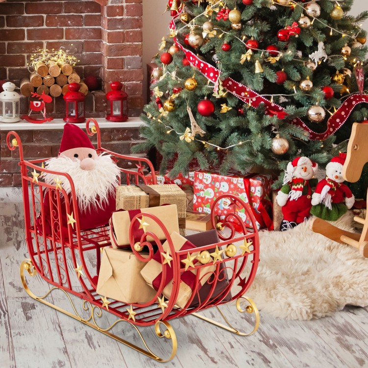 Red metal Christmas Santa sleigh with large cargo area, decorated with gifts, perfect for holiday home decor.