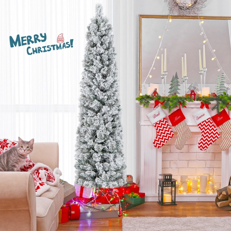 Flocked 6-foot Christmas tree with 258 branch tips and 100 warm white lights, beautifully decorated in a cozy living.