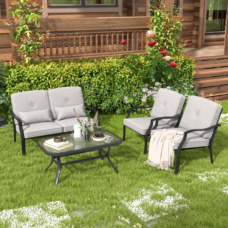 Outdoor loveseat chair set with soft cushions and tempered glass coffee table, perfect for backyard relaxation.