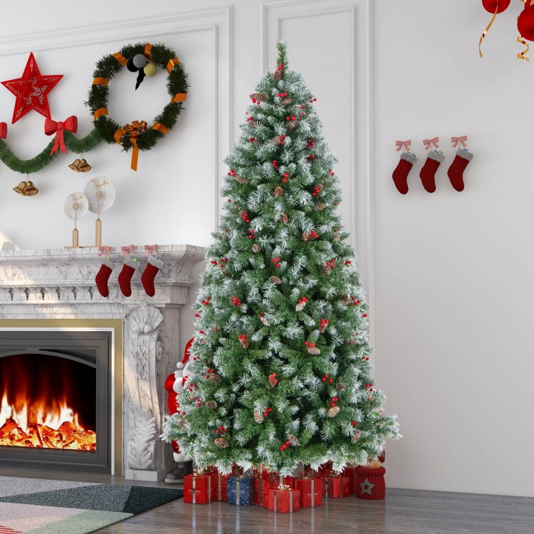 7.5 ft hinged Christmas tree with snowy PVC branch tips, warm white LED lights, and red berries for festive decor.