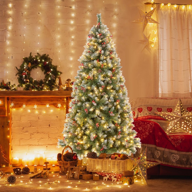 Hinged 7.5 ft Christmas tree with snowy PVC branch tips and warm white LED lights, perfect for festive home decor.