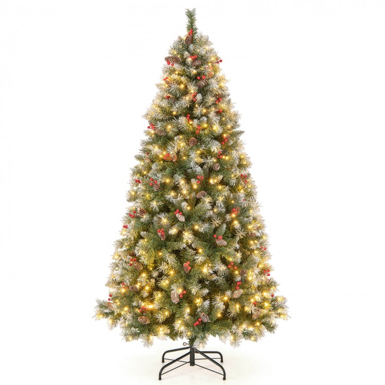 Hinged 7.5 ft Christmas tree with snowy PVC branch tips and warm white LED lights, adorned with red berries and pine.