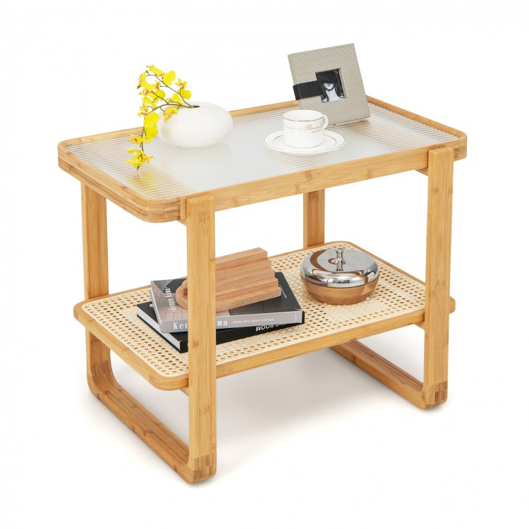 Bamboo side table with glass top, featuring a spacious surface and rattan shelf, perfect for living room or bedroom use.