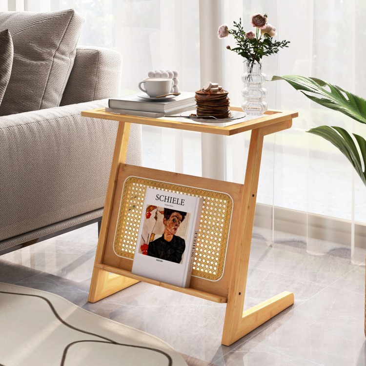Z-shaped end table with natural bamboo, rattan shelf for magazines, and elegant glass top, perfect for narrow spaces.