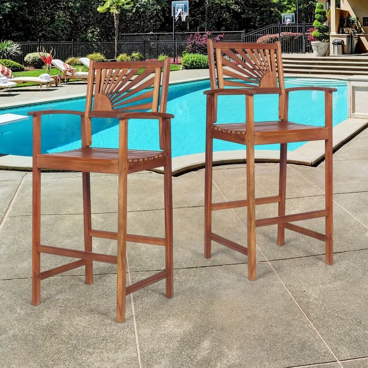 Two outdoor acacia wood bar chairs with sunflower backrest, perfect for patio use and comfortable seating by the pool.