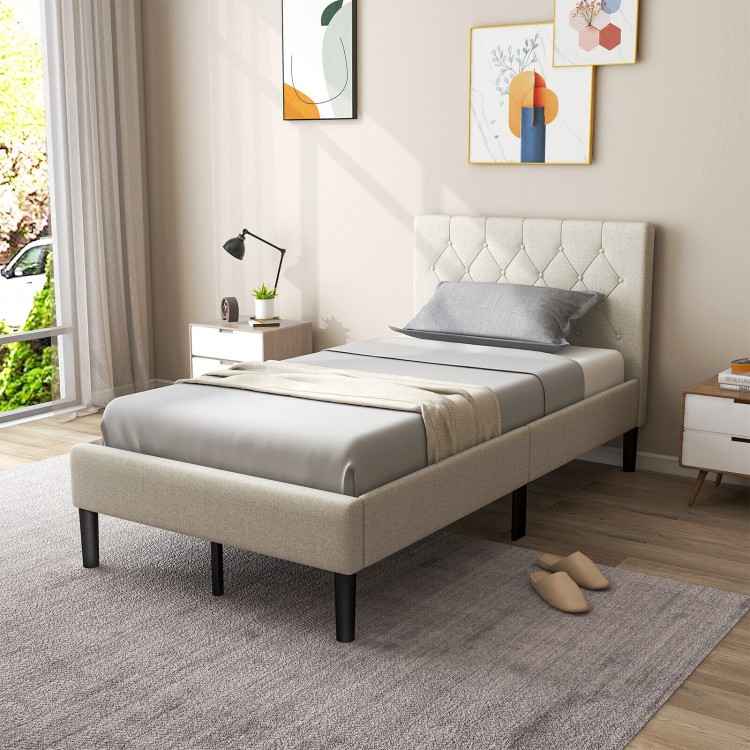 Twin size upholstered platform bed in beige with button tufted headboard, ideal for bedrooms or guest rooms.