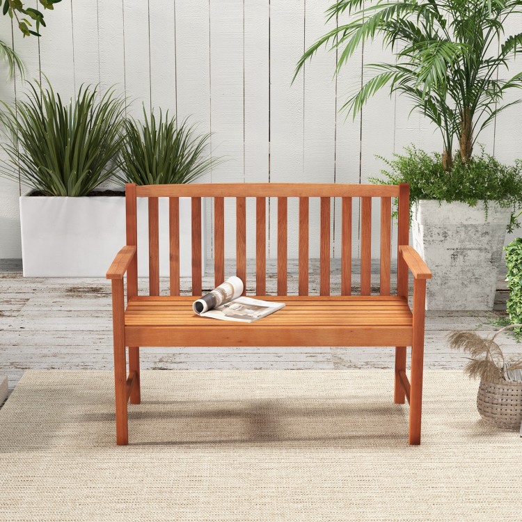 2-seat patio wood bench made of eucalyptus with cozy armrests, slatted seat, ideal for garden or poolside relaxation.
