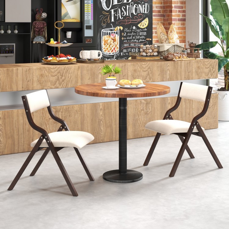 Set of 2 wooden folding dining chairs with linen fabric padded seats, perfect for compact spaces in cafes or homes.