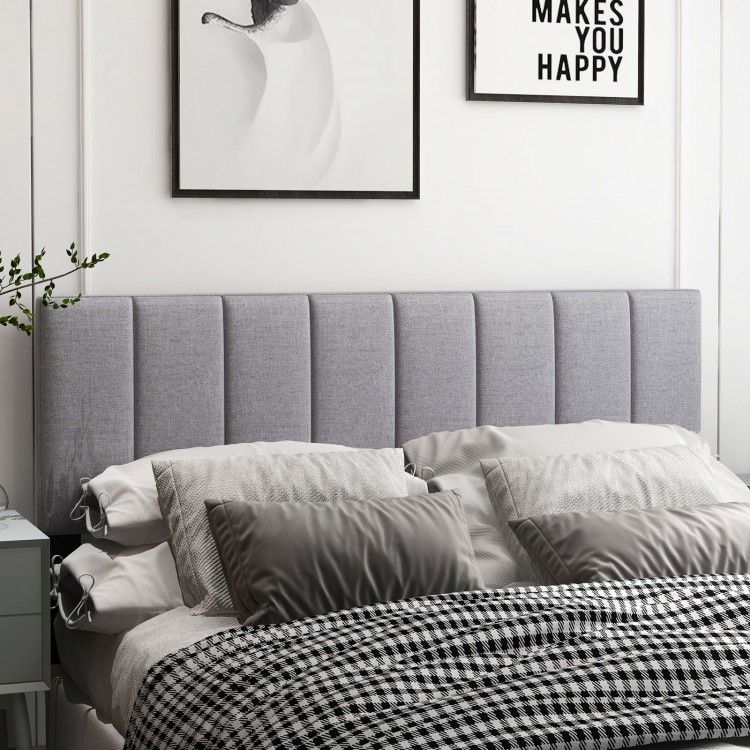 Gray linen upholstered headboard with vertical channel tufting, solid wood legs, and adjustable width for full or queen.