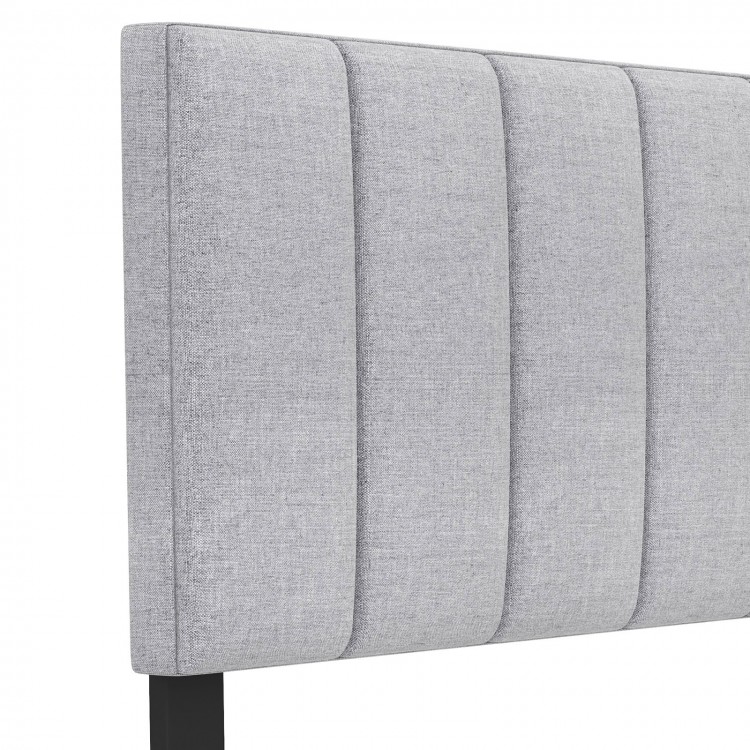 Gray linen upholstered headboard with vertical channel tufting and solid wood legs, designed for full and queen size.
