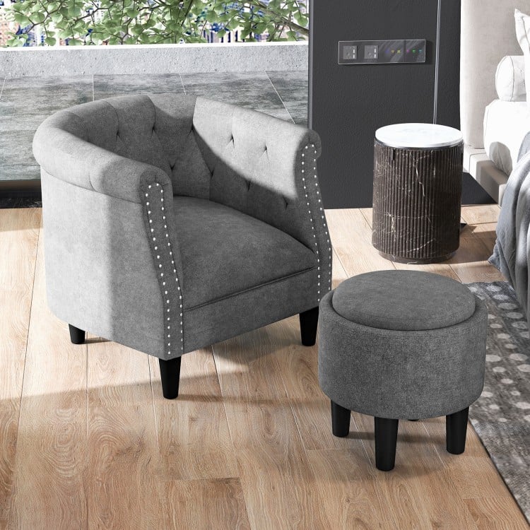 Modern grey accent chair with tufted design and matching ottoman, perfect for living room or bedroom relaxation.