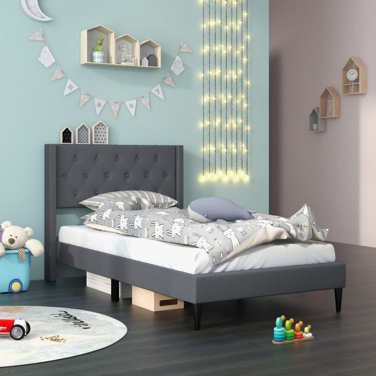 Twin size upholstered platform bed in gray with button tufted wingback headboard, ideal for bedrooms and guest rooms.