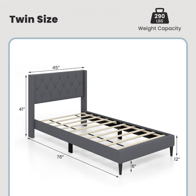 Twin size upholstered platform bed in gray with button tufted headboard and solid wood legs, ideal for bedroom or dorm.