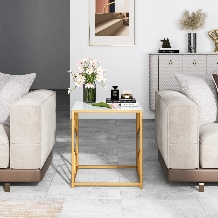 Square end table showcasing a sleek tempered glass top and elegant gold frame, enhancing modern living spaces.