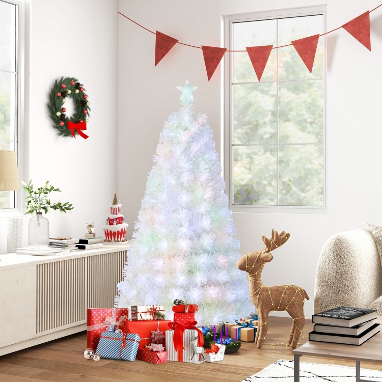 5-foot pre-lit fiber optic white snow-flocked Christmas tree with gifts, creating a festive winter wonderland ambiance.