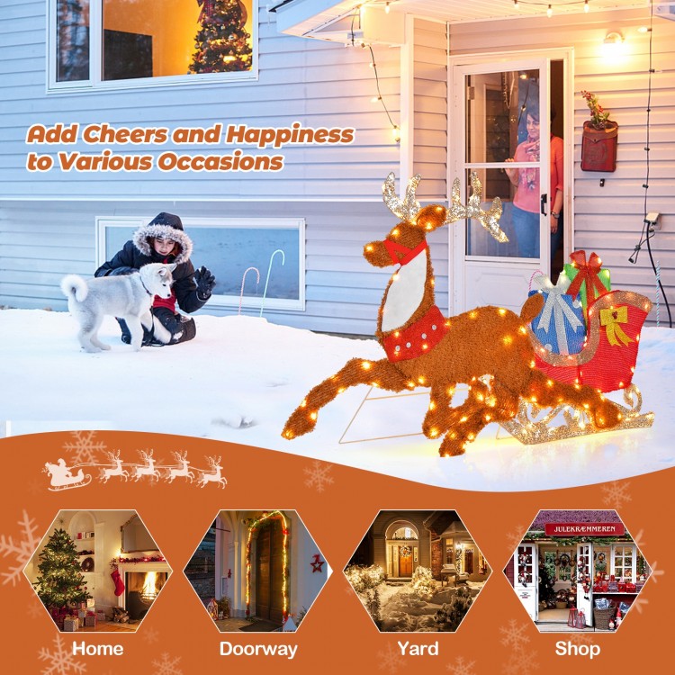 Lighted 2D Christmas reindeer and sleigh decoration with bright lights for festive outdoor display at home.