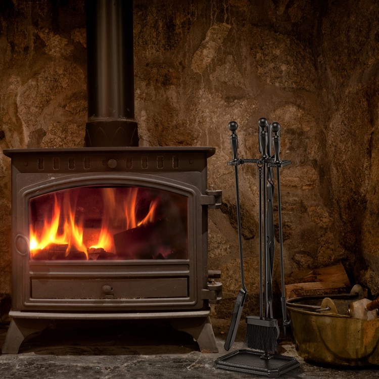 5-piece black fireplace tool set with ergonomic handles, including tongs, brush, shovel, and poker, beside a cozy fire.