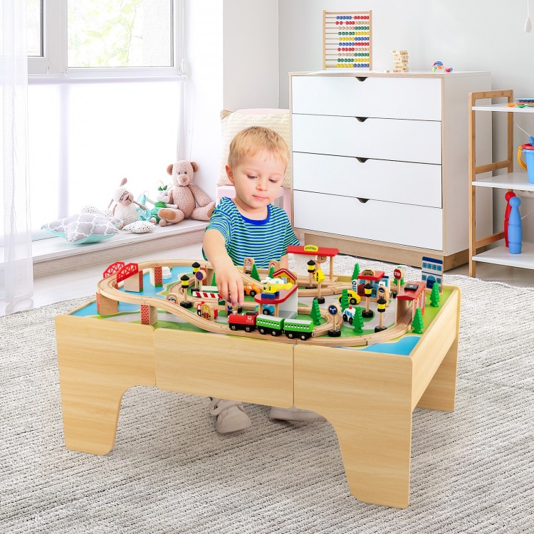 Wooden train set with 84 pieces on a reversible tabletop, designed for kids' play, study, and creativity.