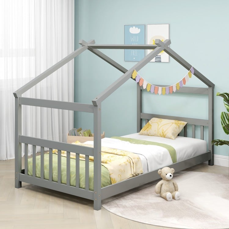 Twin size gray wooden house bed with roof, featuring solid wood support and slats, perfect for kids' themed rooms.