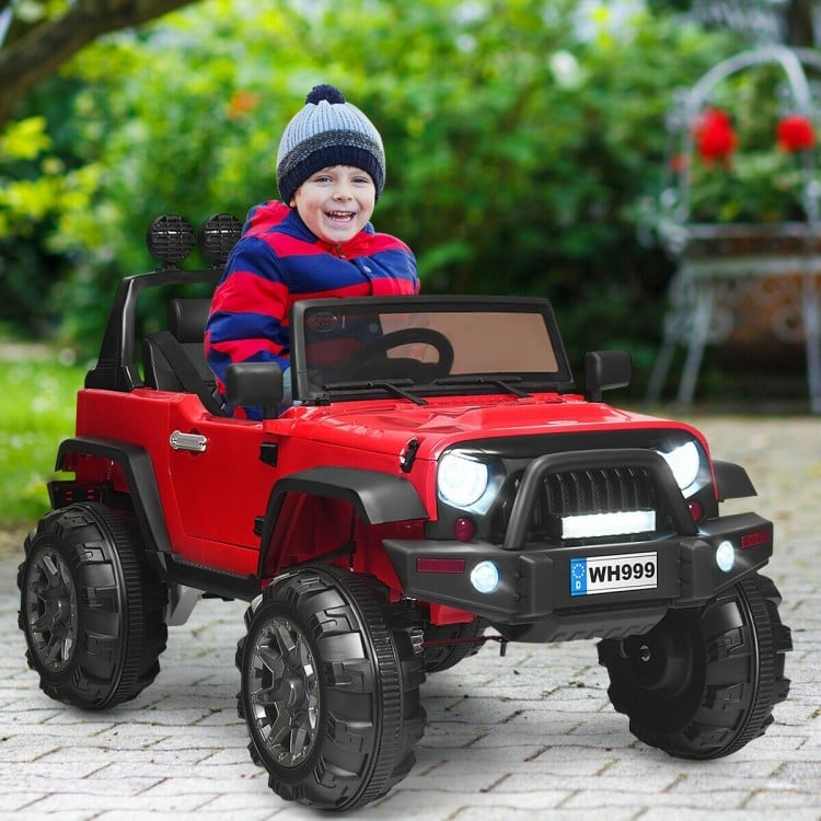 Red 12V kids ride-on truck with remote control, LED lights, and spacious seat for outdoor fun and play.