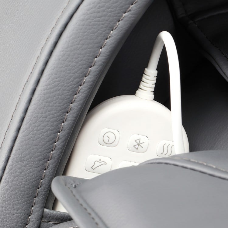 Close-up of the remote control stored in the side pocket of the Provox 27-Comfort 2D Massage Chair in gray.