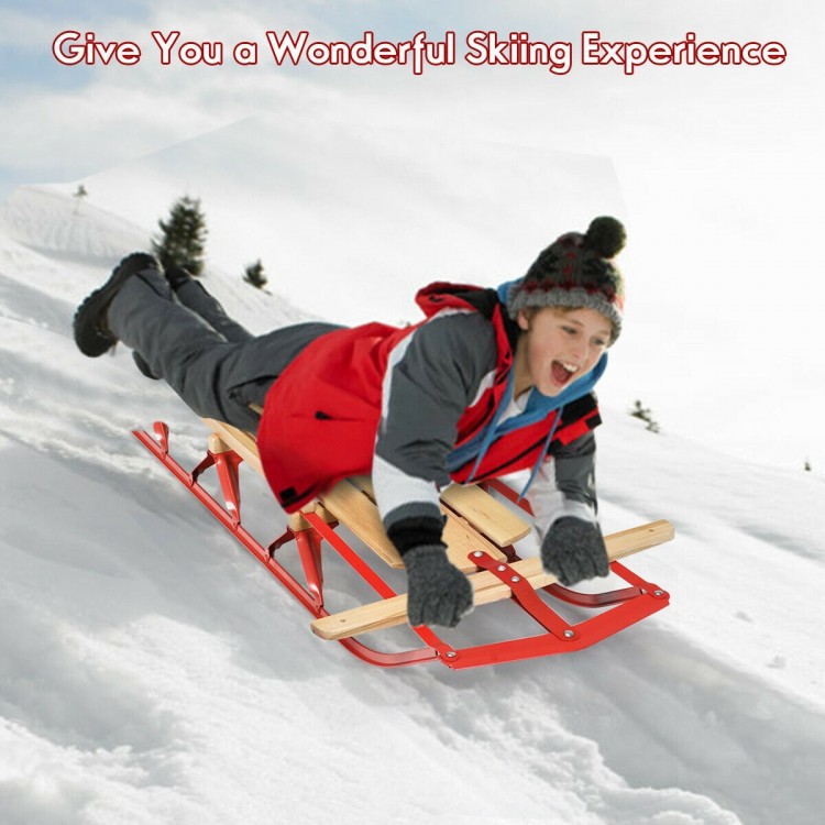 Kids wooden snow sled with metal runners and steering bar, designed for smooth sliding and easy control in the snow.