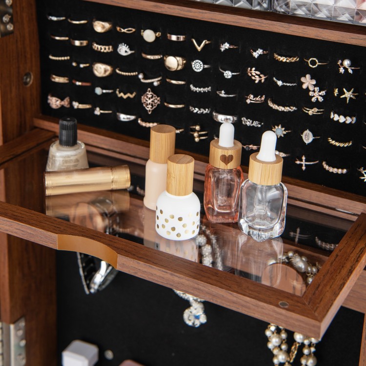 Jewelry cabinet with makeup shelf, featuring organized storage for bottles and accessories, in walnut finish.