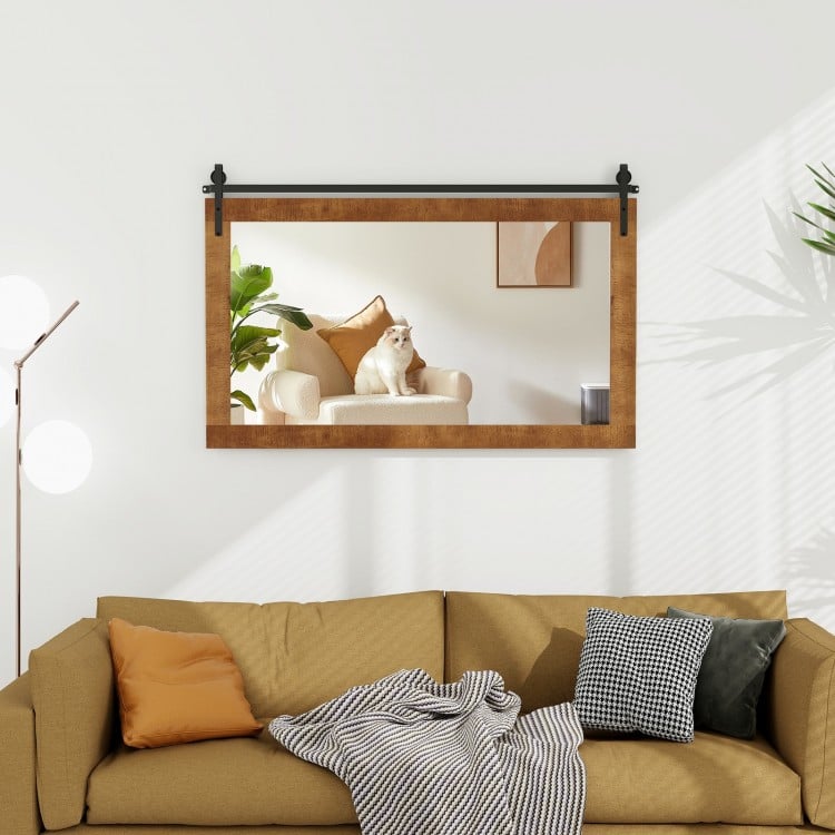 Barn door style wall-mounted mirror with solid wood frame, enhancing spaciousness in living rooms and entryways.