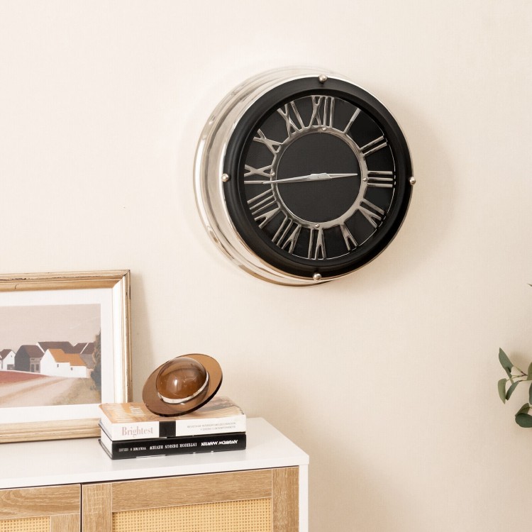 Silent wall clock with silver frame and decorative numbers, perfect for any room decor and easy to hang.
