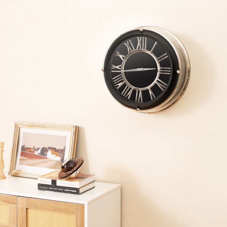Silent wall clock with silver frame and decorative numbers, perfect for adding elegance to any room decor.