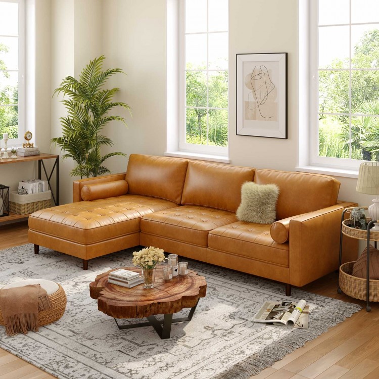 Chaise lounge side of a brown L-shaped sectional sofa with tufted air leather, offering ample seating for comfort.