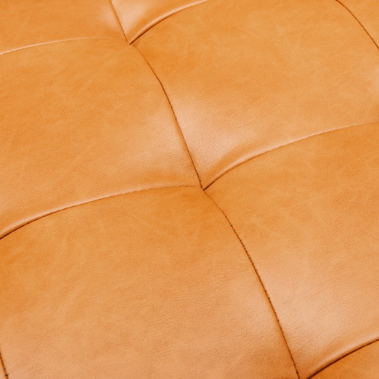 Close-up of the brown lattice-tufted air leather on the 3-seat L-shaped sectional sofa, showcasing its elegant texture.