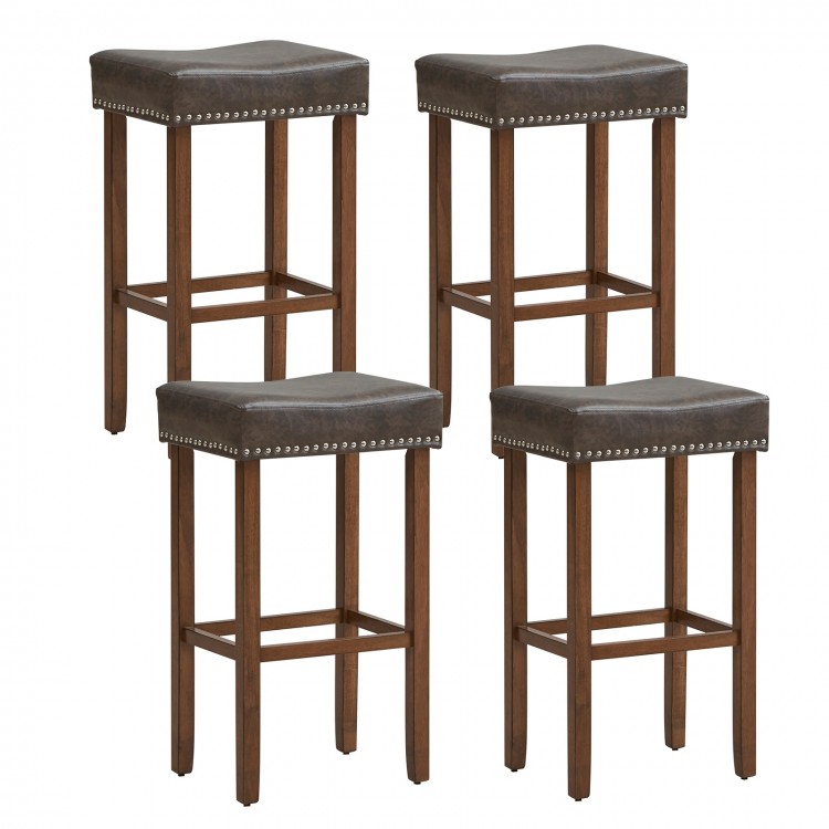 Set of four saddle-shaped upholstered bar stools with gray PU leather and natural rubber wood legs for versatile use.