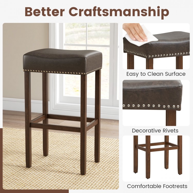 Saddle-shaped upholstered bar stool with gray PU leather, natural rubber wood legs, and comfortable footrests for.