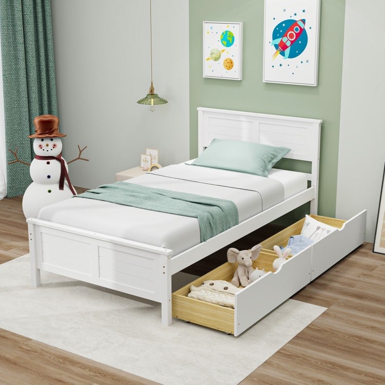 Twin size bed frame in white with large pull-out storage drawers, perfect for kids' rooms or small apartments.