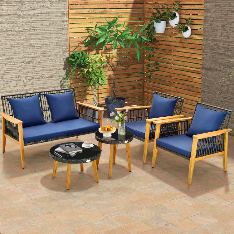 5-piece outdoor conversation set featuring navy cushions, acacia wood frame, and two coffee tables for backyard.