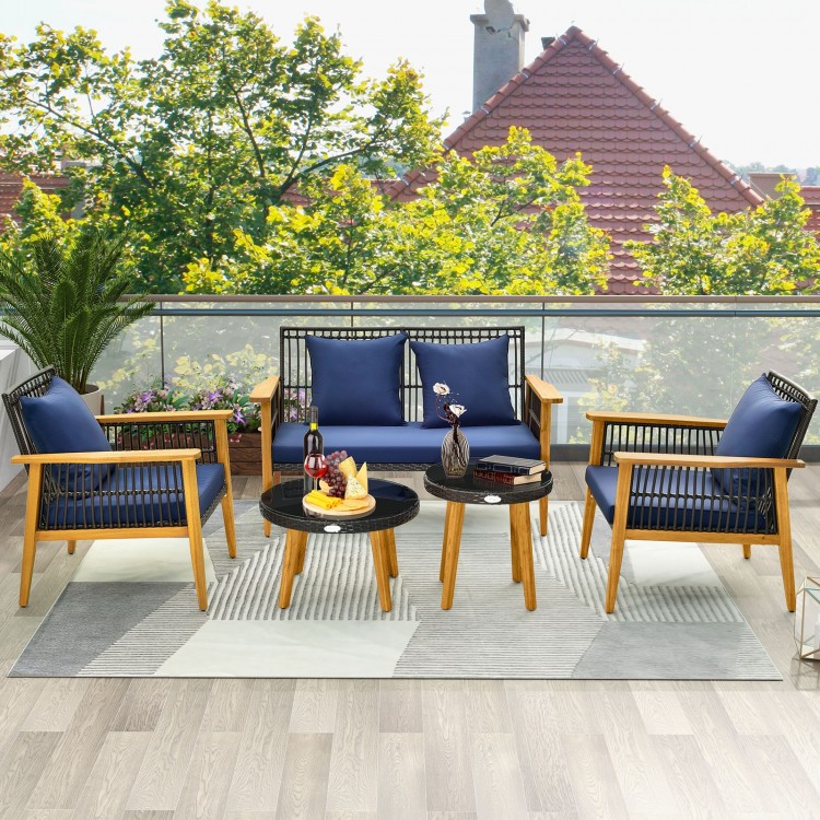 Elegant 5-piece outdoor conversation set showcasing navy cushions, acacia wood frames, and two coffee tables for.