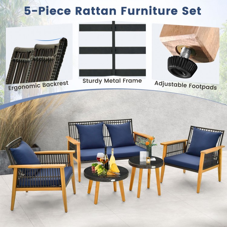 Close-up of the navy cushion on a chair with an ergonomic backrest and stylish woven PE rattan for outdoor comfort.