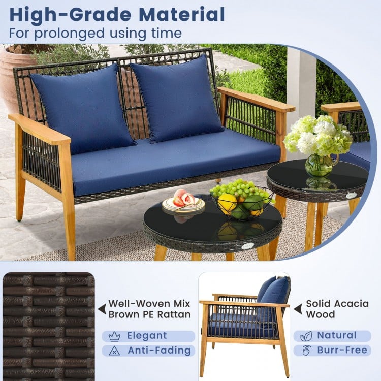 Navy blue cushions on a 5-piece outdoor conversation set with solid acacia wood and elegant PE rattan for backyard use.