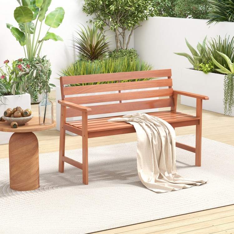 Solid wood patio bench with slatted seat and inclined backrest, ideal for outdoor relaxation on the porch or balcony.