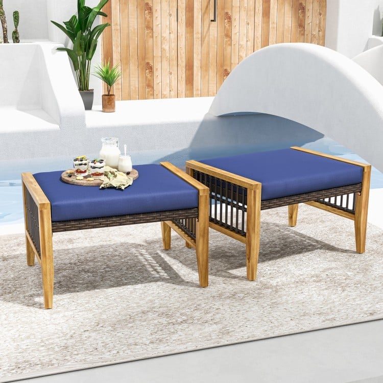 Navy cushion patio ottomans with acacia wood frame and PE rattan design, ideal for outdoor relaxation by the poolside.