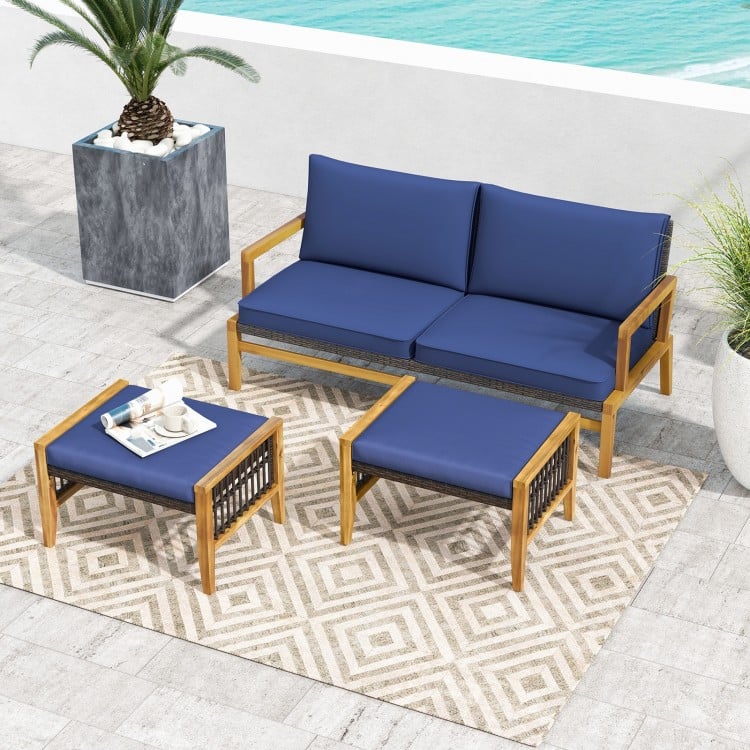 Navy cushion ottomans made of acacia wood and PE rattan, ideal for outdoor use by the poolside or backyard.