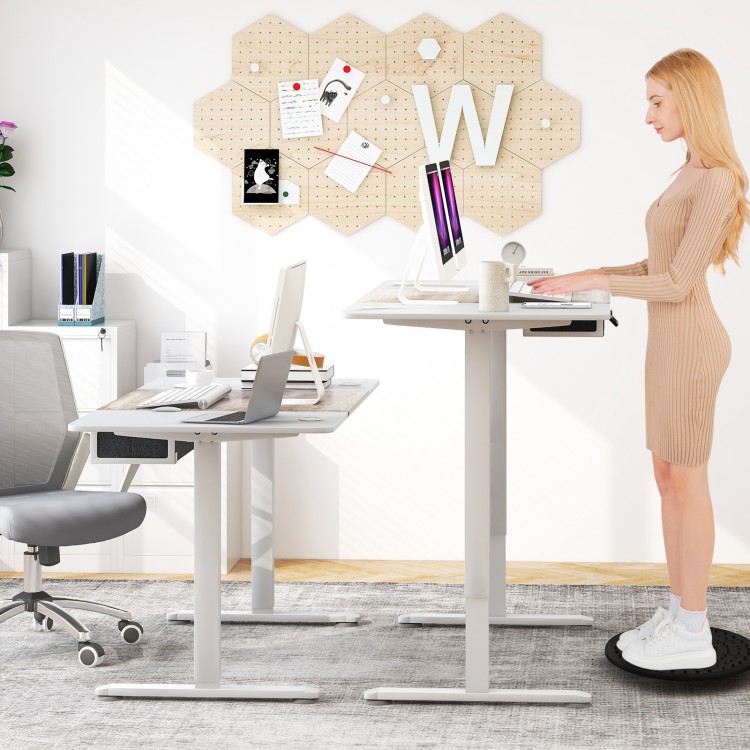 Height adjustable electric standing desk in gray with USB charging port, perfect for a healthier work posture.
