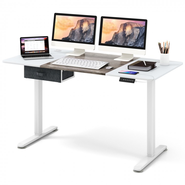 Height adjustable electric standing desk in gray with dual monitors, USB charging port, and fabric drawer for office.