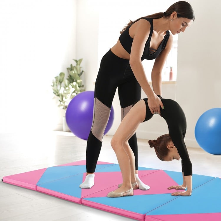 Two people using an 8 feet pink and blue folding gymnastics mat, ideal for fitness and kids' activities.