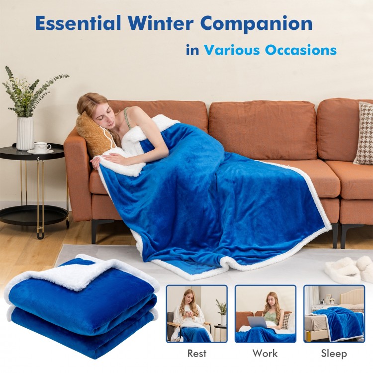 Reversible blue electric heated blanket throw in flannel and sherpa, perfect for warmth while resting or sleeping.